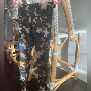 Green leggings with multicolor stars